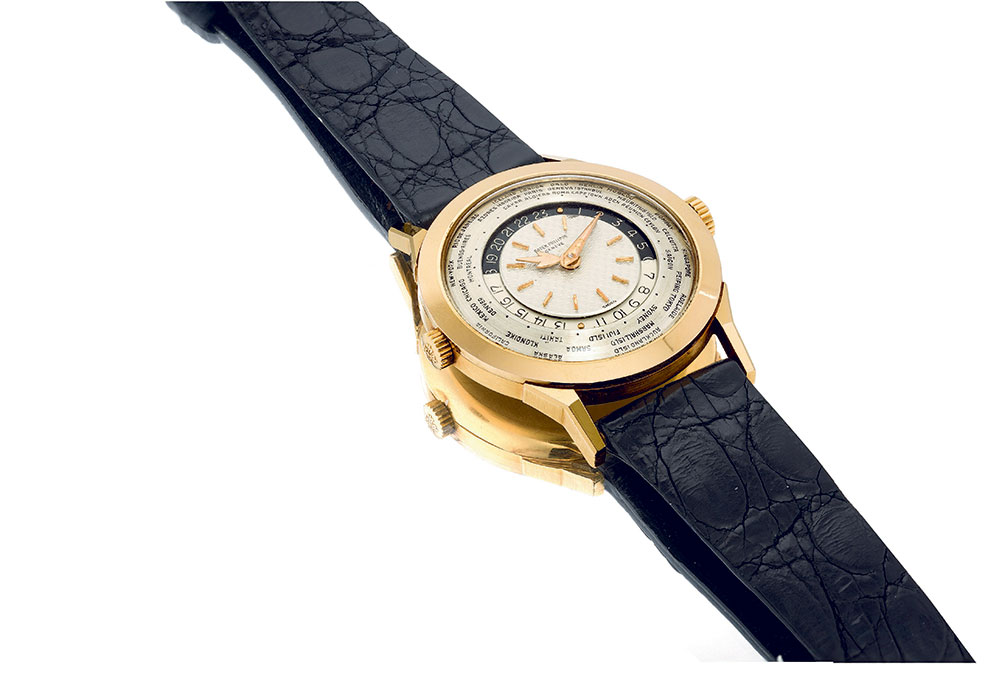 Lot 373, Patek Philippe. An extremely fine, highly important and previously unknown pink gold worldtime wristwatch with two crowns and two-tone dial, ref 25231-2